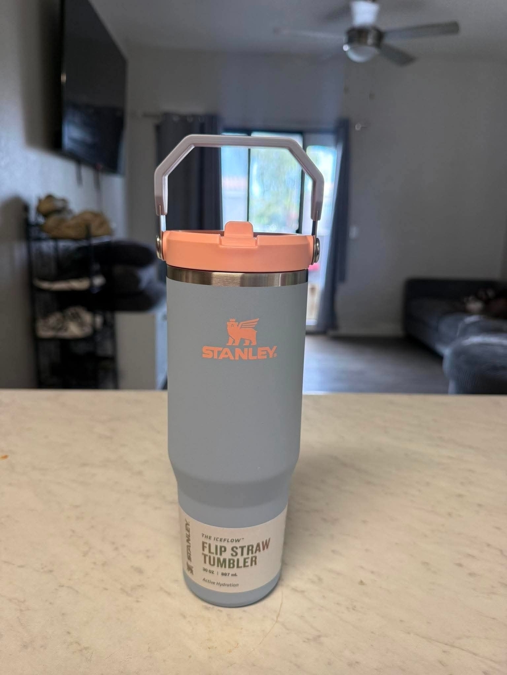 Flip Straw Stanley Light Blue Tumbler with Peach Lid and White Handle